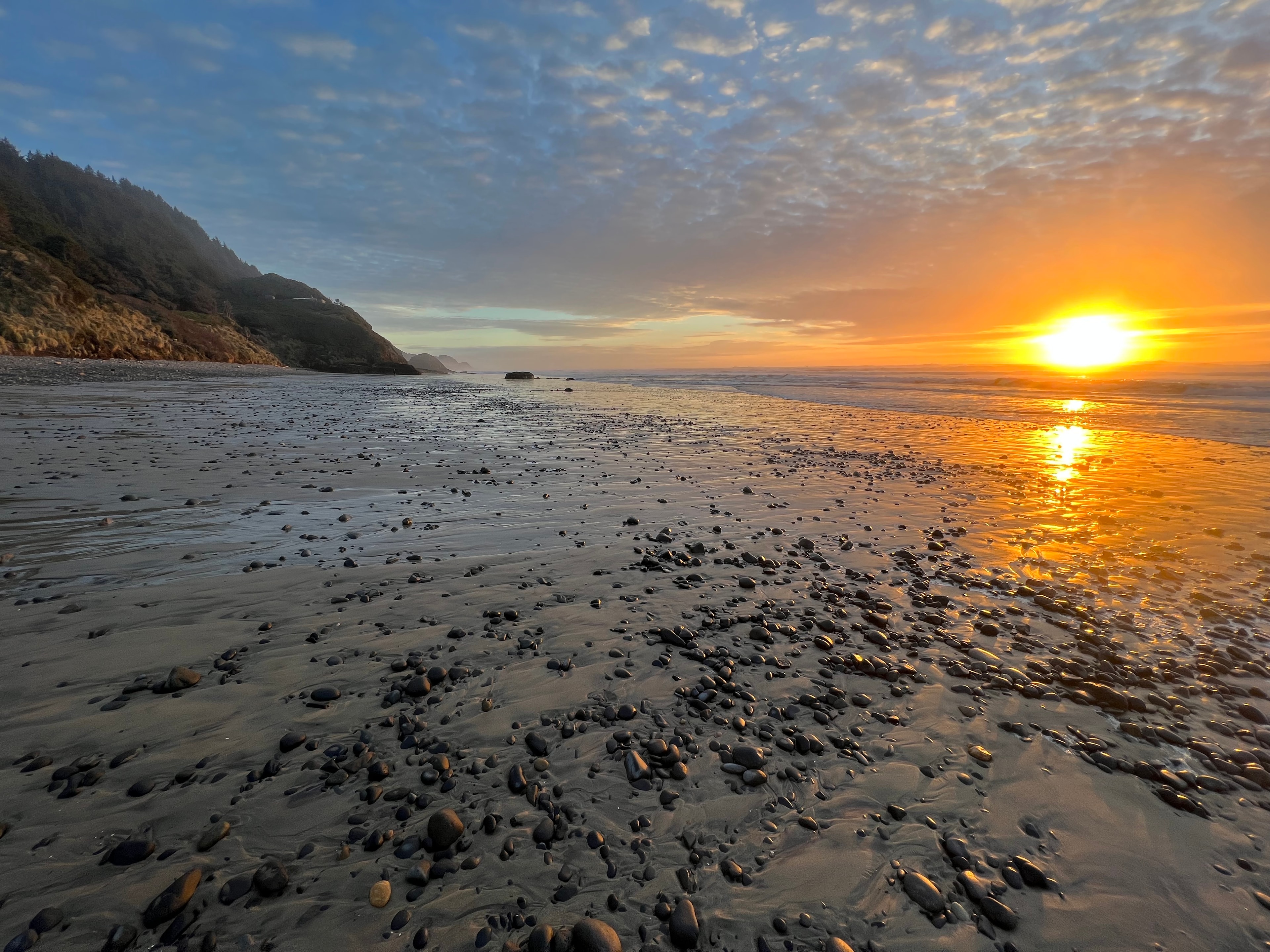 Dramatic Oregon Coast sunset over rocky beach